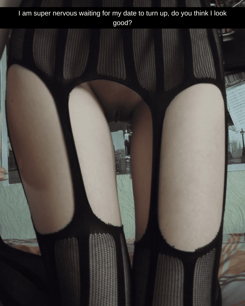 Photo taken of a woman's legs, she is wearing stockings and no panties, we can see her bare pussy